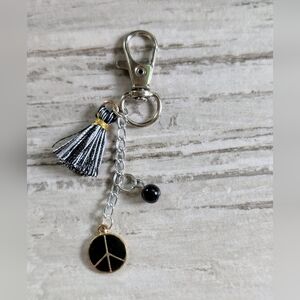 Black and Gold Peace Sign Bag Charm